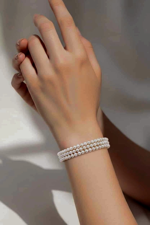 Potrójna bransoletka z białych pereł z gatunku Round