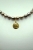Choker z brązowych pereł z Rzymską monetą